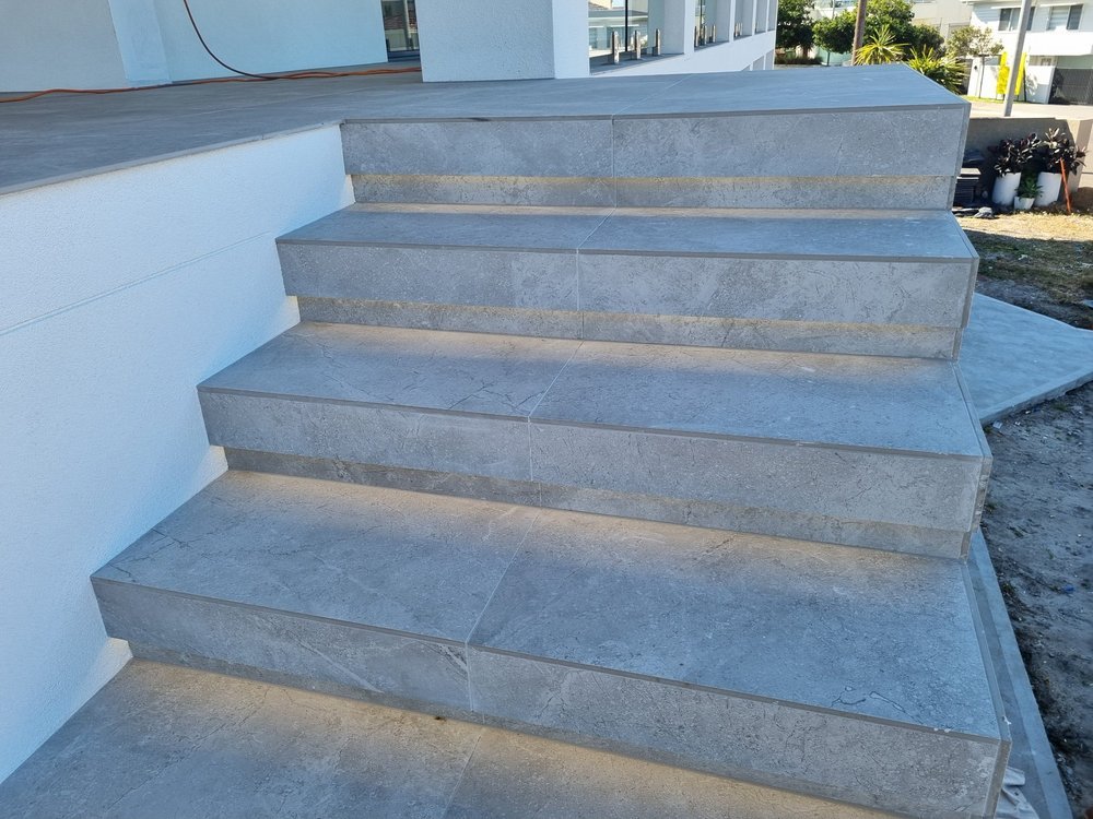 Modern concrete steps with integrated lighting underneath